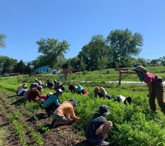 Field shot of crew and youth 
