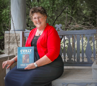 Curly, the Orphan Calf was written in 2017 after the terrible fires in Kansas, Oklahoma, and Texas. It is the first in a three-book series about a fictional calf who survived that fire. Curly, the Hero Cow as well as Curly and the Terrible Tornado stories were inspired by children who heard the first book!